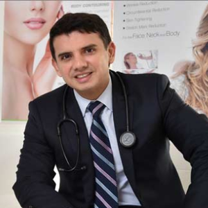 blured Trini Vega, MD