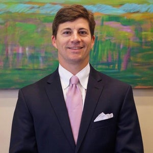 John P. Guste, MD