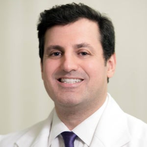 blured Norman M. Rowe, MD - Account Suspended