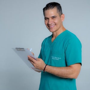 blured Carlos Alberto Ríos García, MD