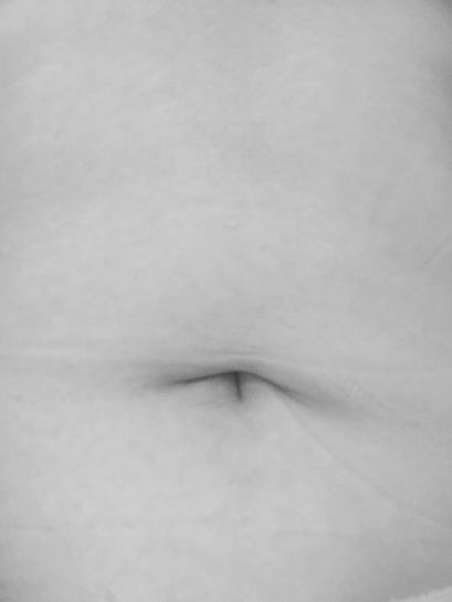 frowning belly button